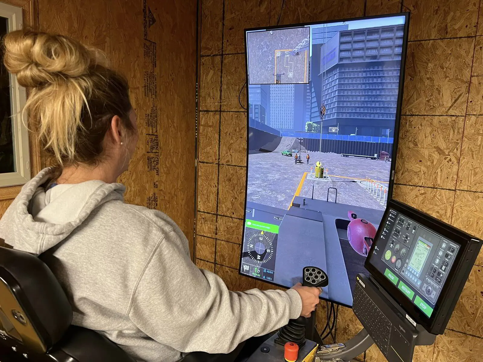 Student training on the crane simulator during a premium crane operations course