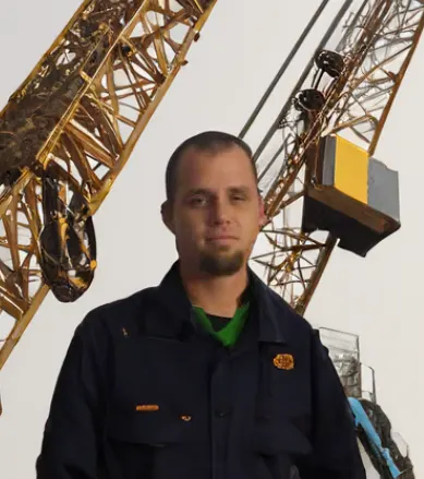 Paul Kersey, in-person crane instructor, in front of a lattice boom crane