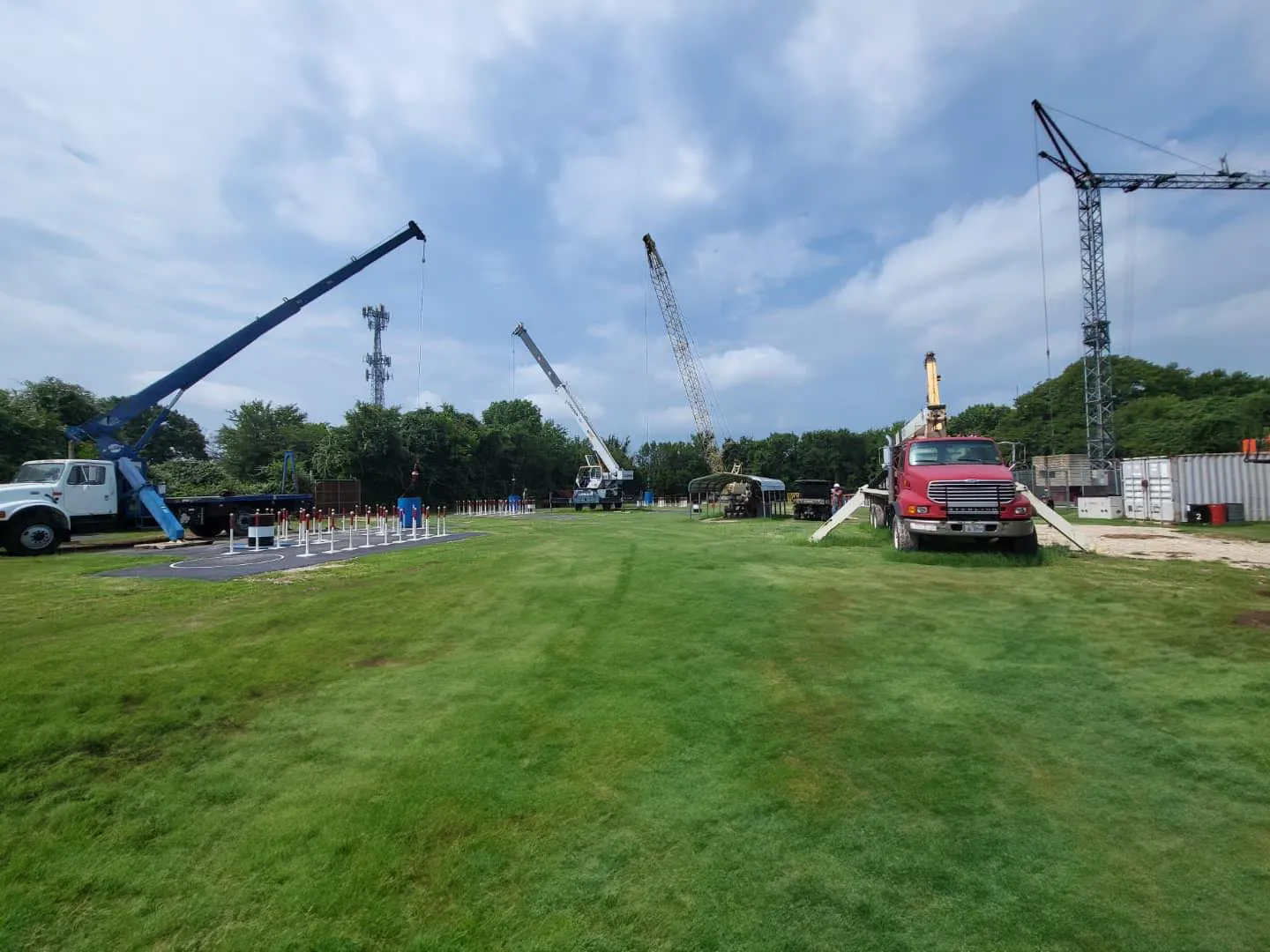 Training yard at Miller Crane Works with a tower crane, lattice crawler and truck crane